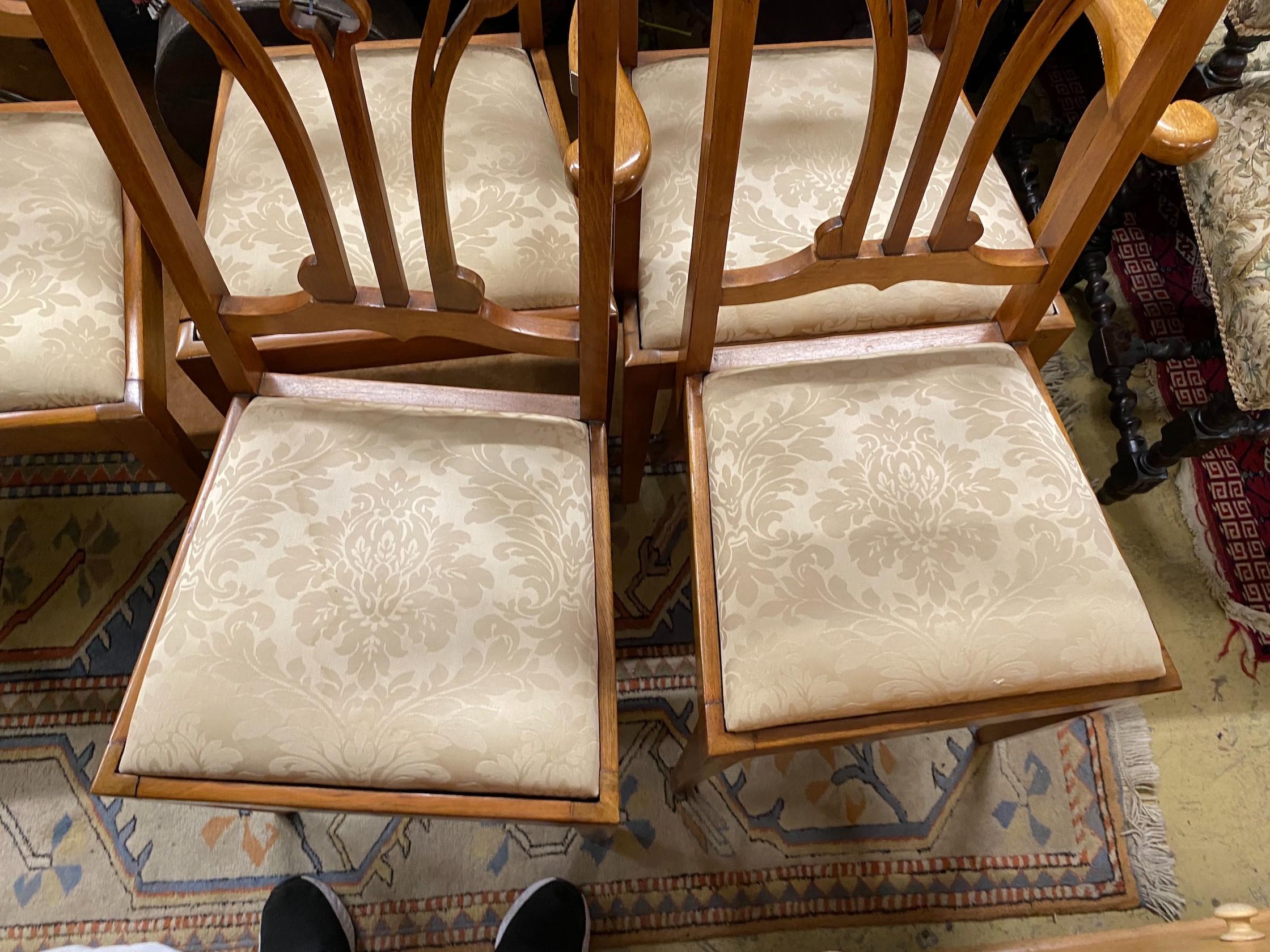 Five Art Nouveau walnut dining chairs, one with arms